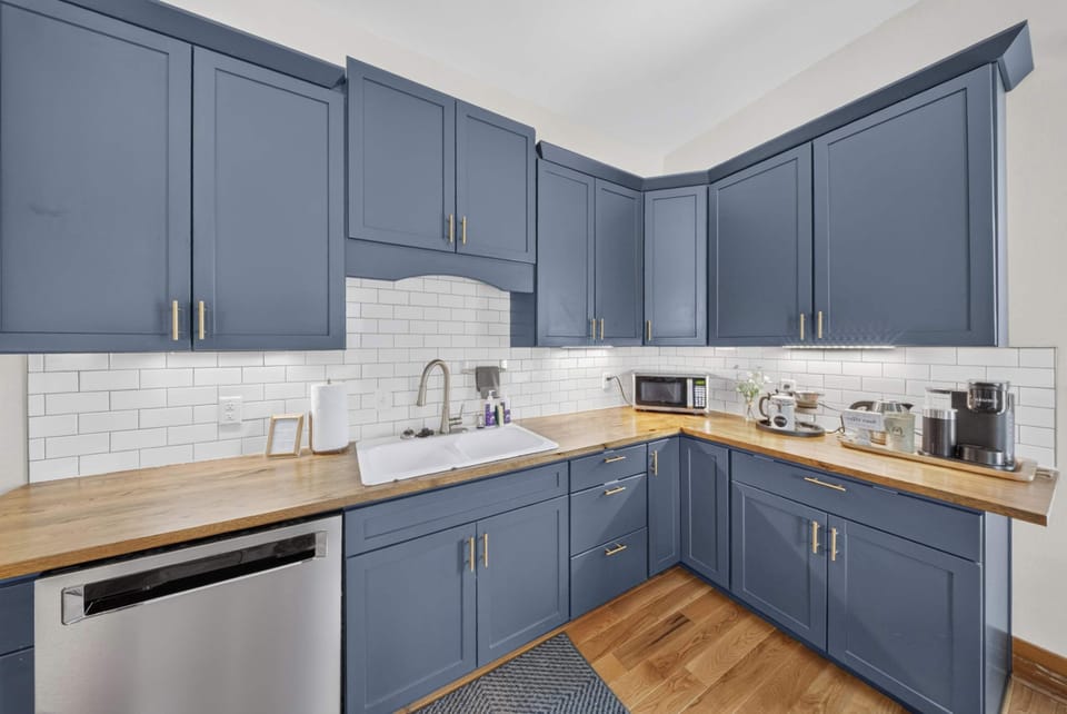 Chef’s functioning kitchen with modern stainless steel appliances