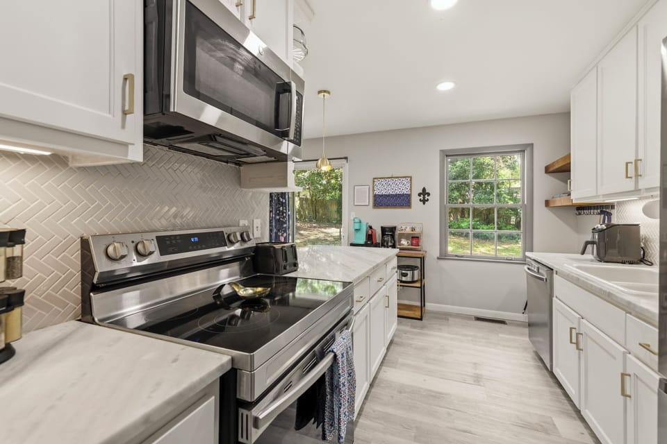 Glass top stove with oven and overhead microwave