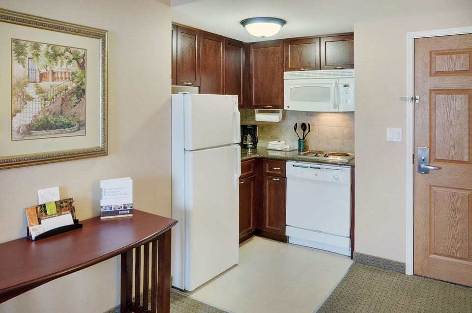Fully equipped kitchen with modern appliances for meal preparation.