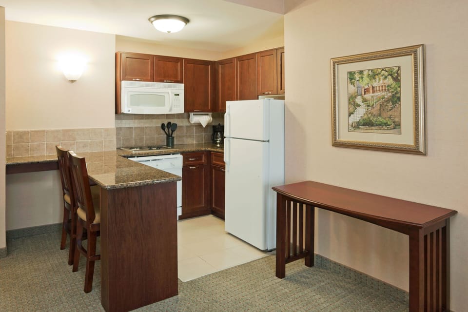 Fully equipped kitchen with modern appliances for meal preparation.