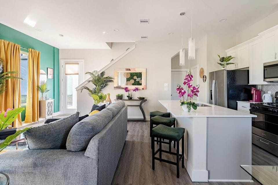 Living Room: Bright colors and modern furnishings create a vibrant space for relaxation and fun!