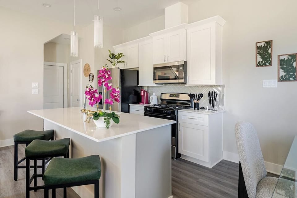 Kitchen: Bright and stylish space with modern appliances and vibrant floral accents!