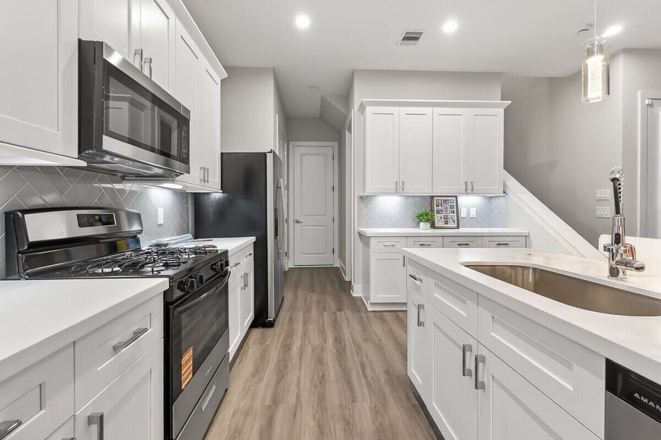 Gourmet Kitchen: Whip up culinary delights in this stunning, modern space with sleek appliances!
