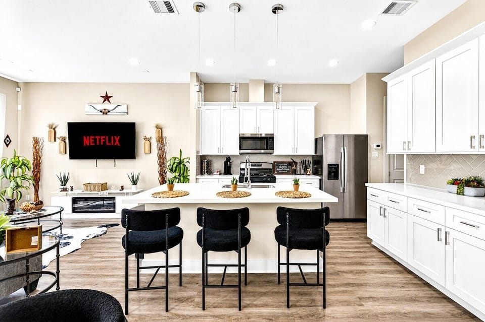 Kitchen Oasis: Modern design meets functionality with sleek appliances and bar seating for gatherings!