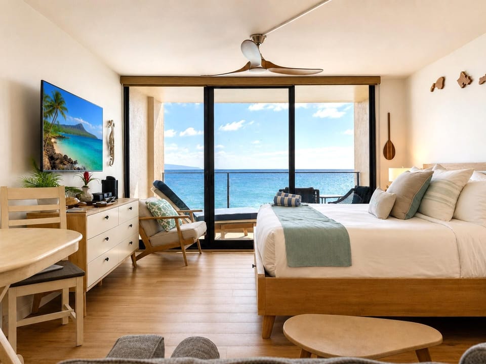 The bright open living area offers comfortable seating and stunning oceanfront views