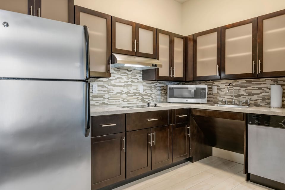 Stylish kitchen equipped with modern appliances and ample storage.