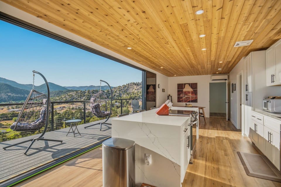 Indoor-outdoor living at its finest! Enjoy stunning mountain views from your modern kitchen and expansive patio.
