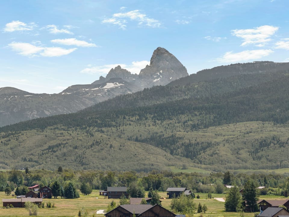 Peaceful mountain retreat with sweeping valley and peak views