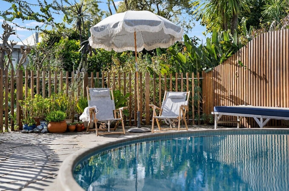 Private pool framed by lush greenery