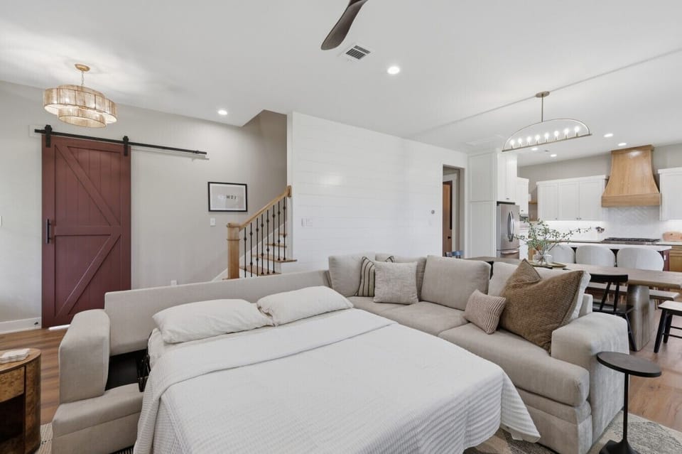 The living room doubles as an additional sleeping area.  Bedding for the queen-sized sofa bed is stored in the downstairs bedroom closet.