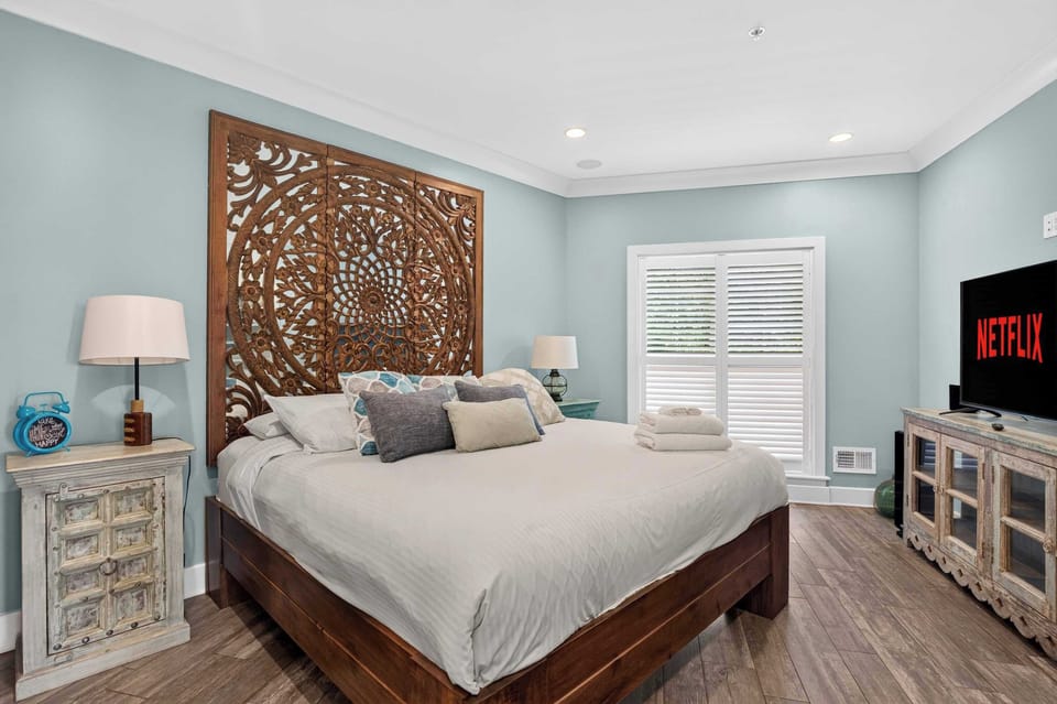 Bedroom 1: Unwind in this cozy king bedroom, featuring a spacious bed, soft bedding, and a relaxing atmosphere perfect for resting after a day of coastal adventures.