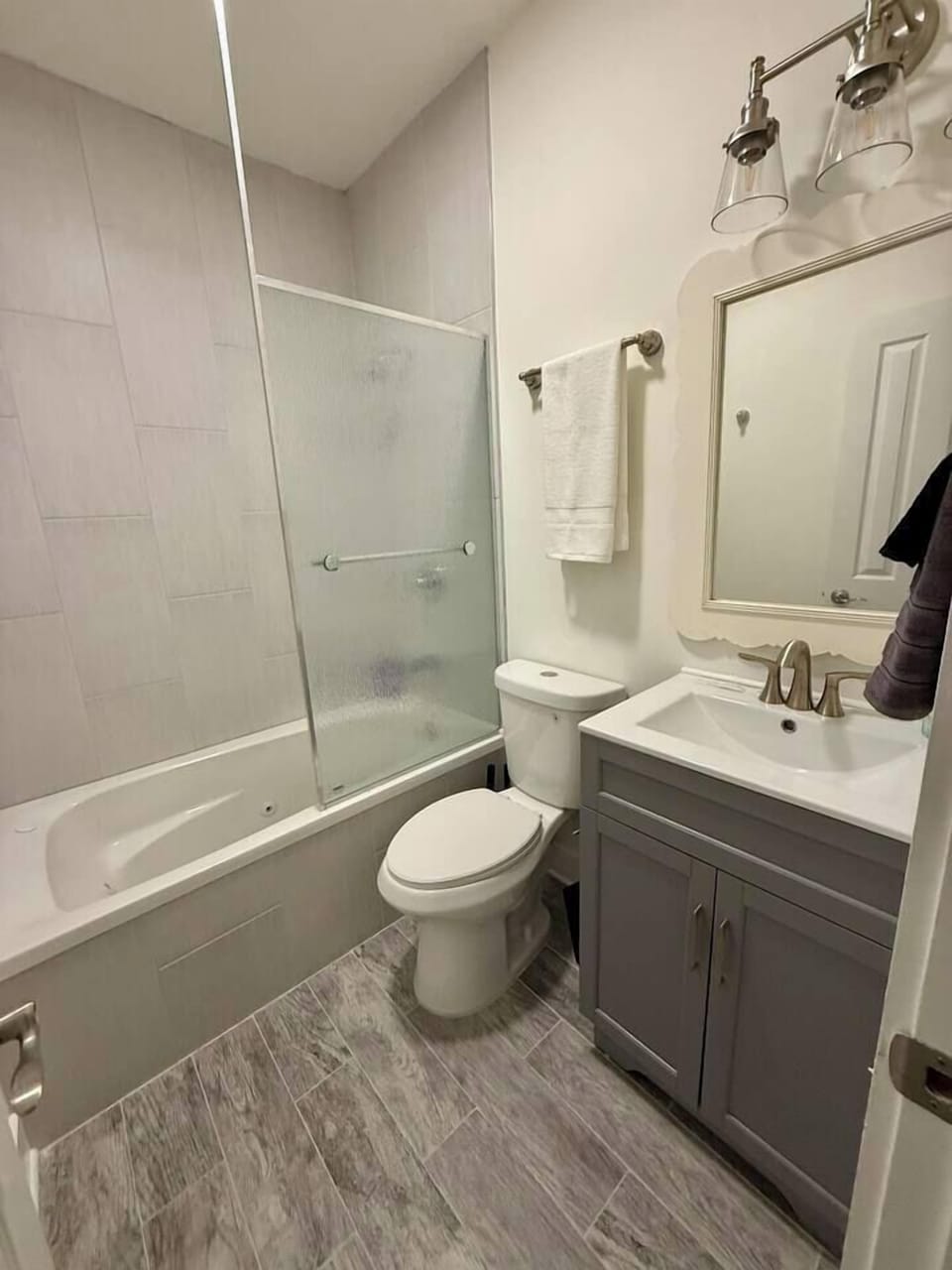 Full bath off of one of the bedrooms.