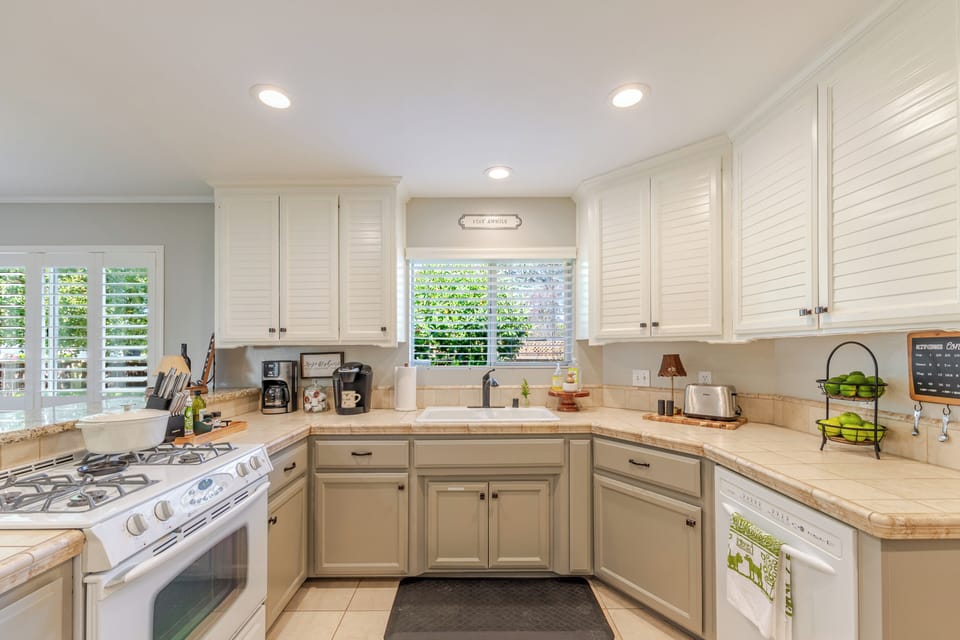 Bright, fully equipped kitchen with gas stove and generous counter space