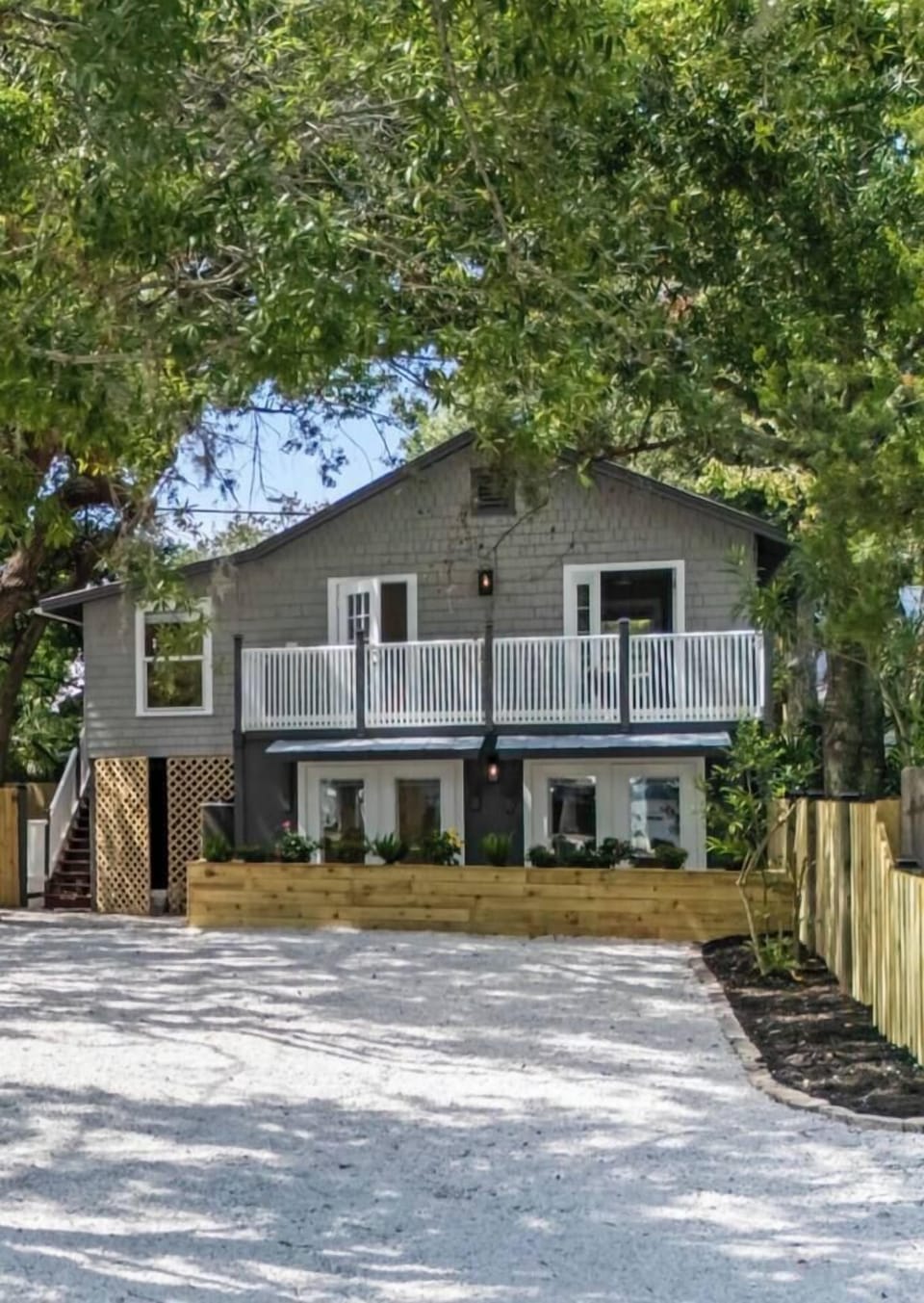 The apartment is the downstairs unit. You enter the living room through the double doors on the right. 