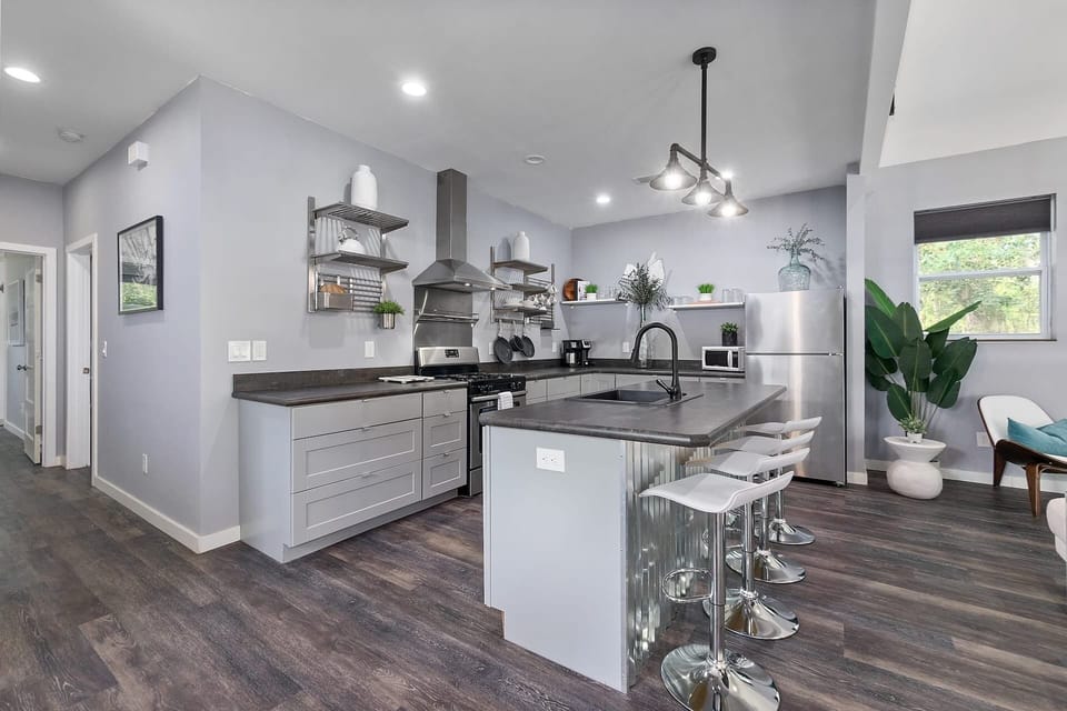 Modern open kitchen with island seating and sleek stainless finishes