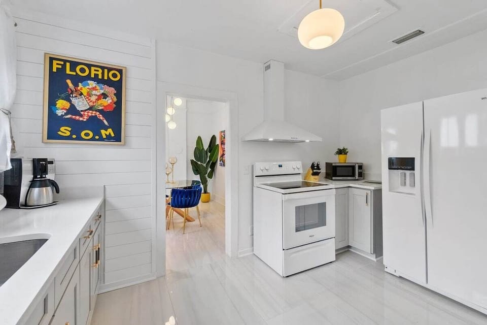 Bright modern kitchen with full appliances and airy open layout