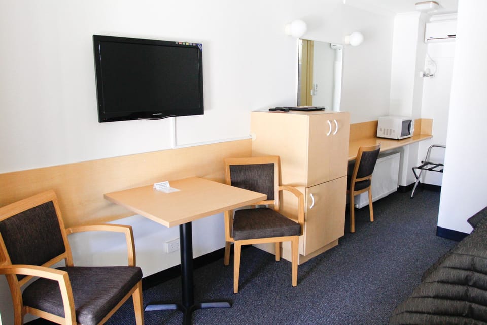 Traditional Double or Twin Room | Living area | 50-inch flat-screen TV with digital channels, TV