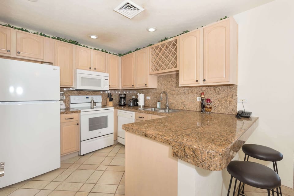 Cook, gather, and enjoy! 🍽️✨ This bright and inviting kitchen has everything you need to feel right at home in paradise! 🌴☀️