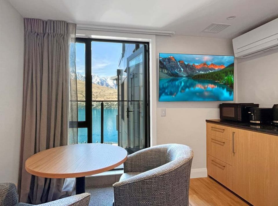 Comfortable dining space perfect for breakfast or planning your Queenstown adventures.