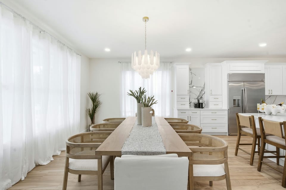 Seating for up to 8 at the dining room table with additional seating at the island 