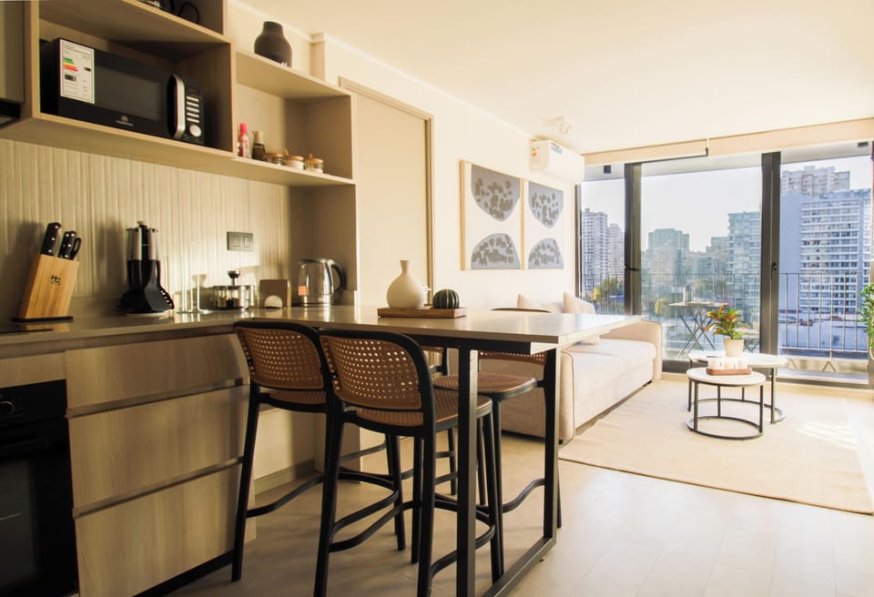 Bright modern living space with balcony and stunning city views