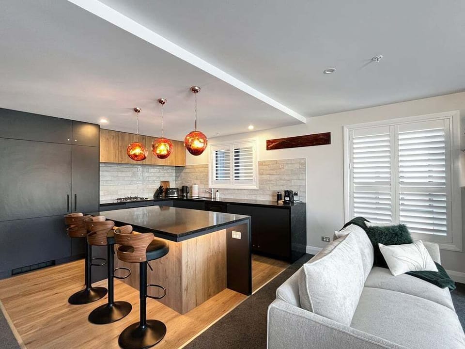 Open-plan kitchen and living area with island bench