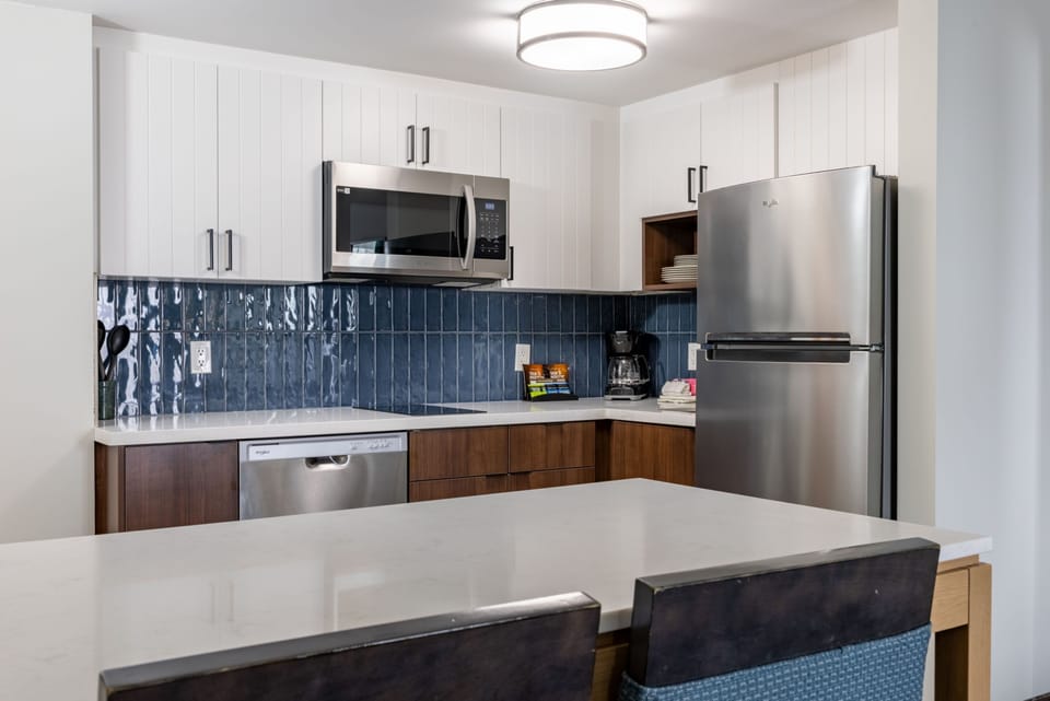 Cook your favorite meals in the fully-equipped kitchen with stainless steel appliances and a long countertop for meal prep.