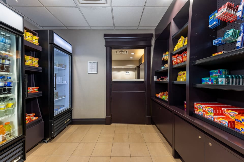 On-site convenience pantry stocked with drinks, snacks, and essentials.