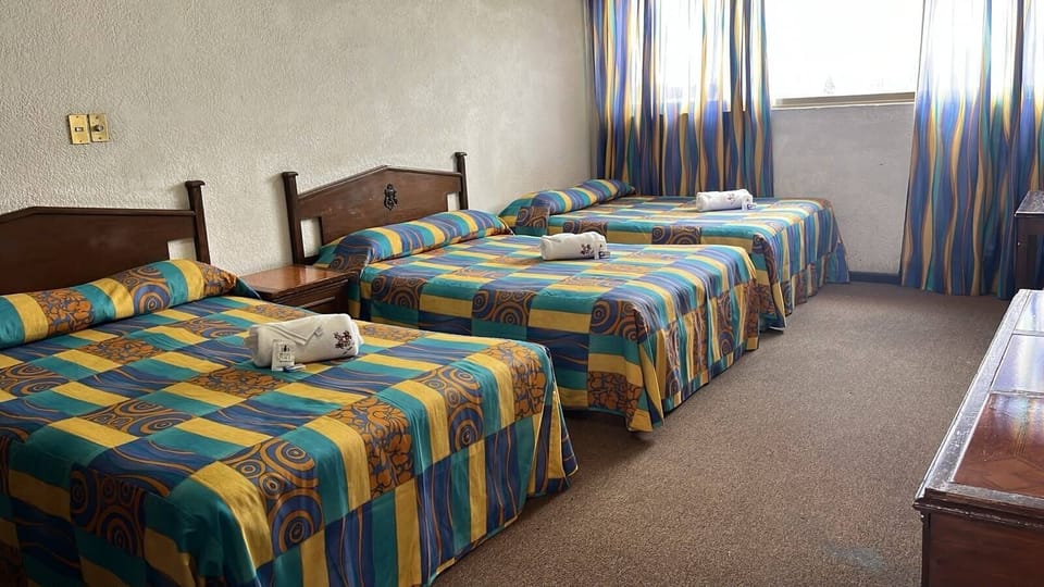 Standard Triple Room, City View | Iron/ironing board, WiFi (free)