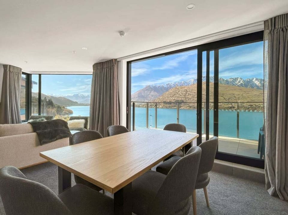 Dining area with lake views and balcony access