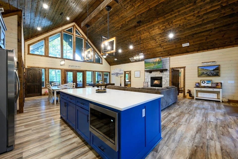 One sweeping glance captures the kitchen, fireplace, and game room — all yours.