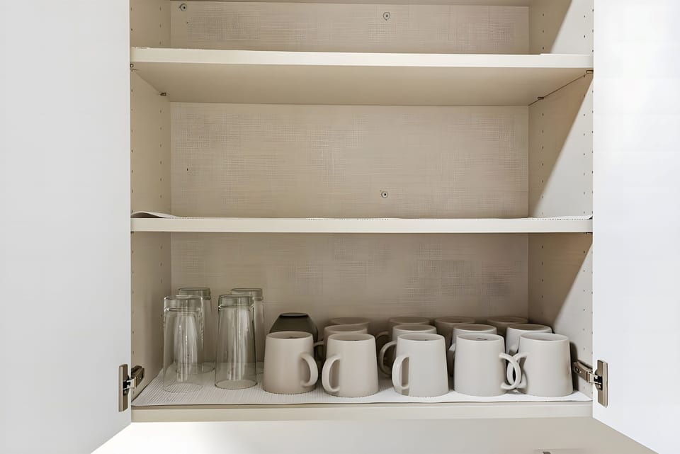 Reach into the clean white cabinets to find matching mugs and drinking glasses. We have everything you need to enjoy drinks with your friends and family.