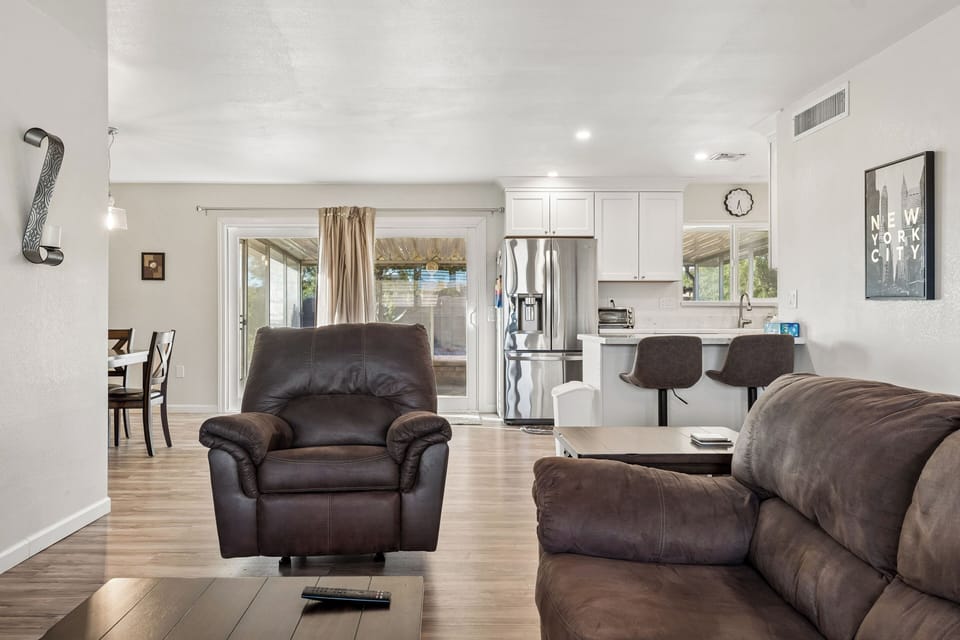 Features a flatscreen TV with streaming, pullout couch for additional sleeping space, and open-concept floor plan.