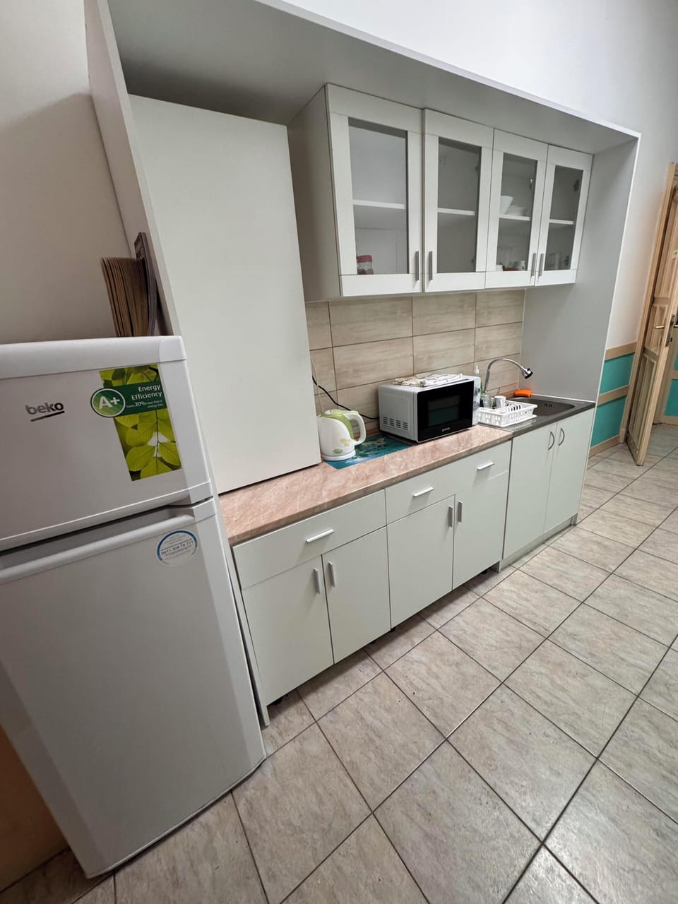 Fridge, microwave, cookware/dishes/utensils