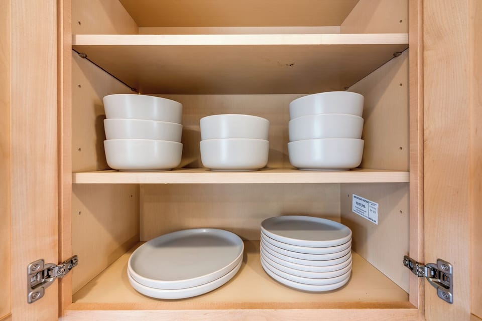  Conveniently arranged dishware makes preparing and serving meals simple.