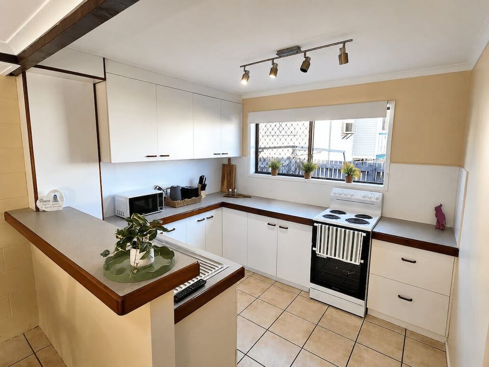 kitchen with microwave oven fridge