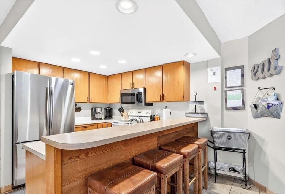 Cook with ease in the fully equipped kitchen, complete with bar seating for casual meals and conversation.