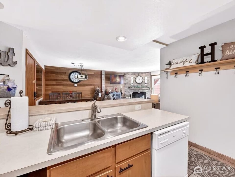 The fully equipped kitchen opens to the living and dining areas, making meals and gatherings effortless.