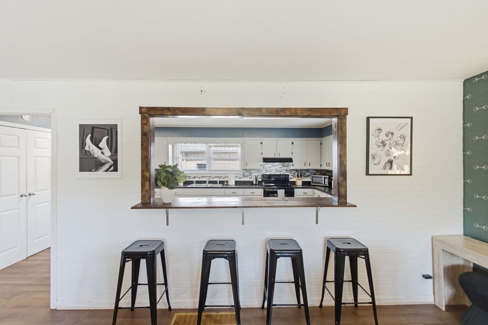 The kitchen is conveniently connected to the living room, with bar seating that keeps everyone together while meals are being prepared.