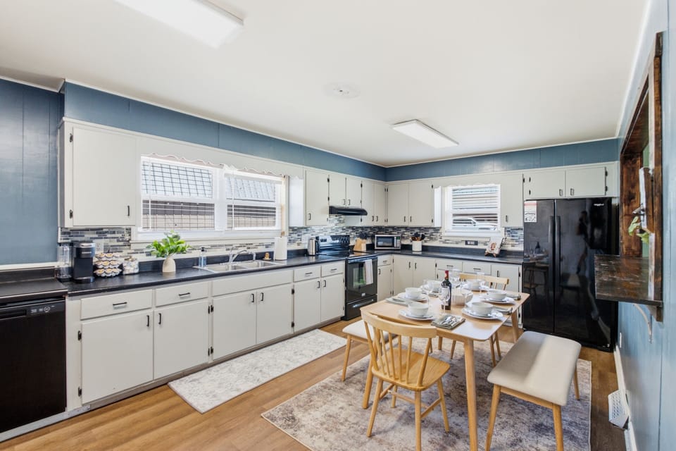 A bright and spacious kitchen with plenty of counter space, full-size appliances, and everything you need to prepare meals for your group.