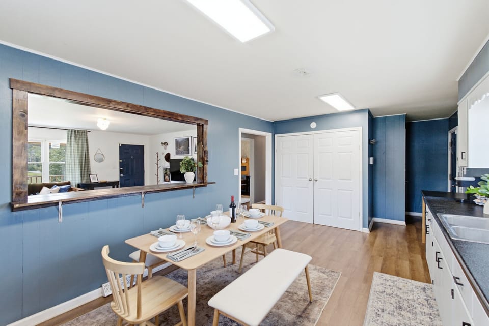 Enjoy meals together in our spacious eat-in kitchen, with seating for the group and an open connection to the living room.