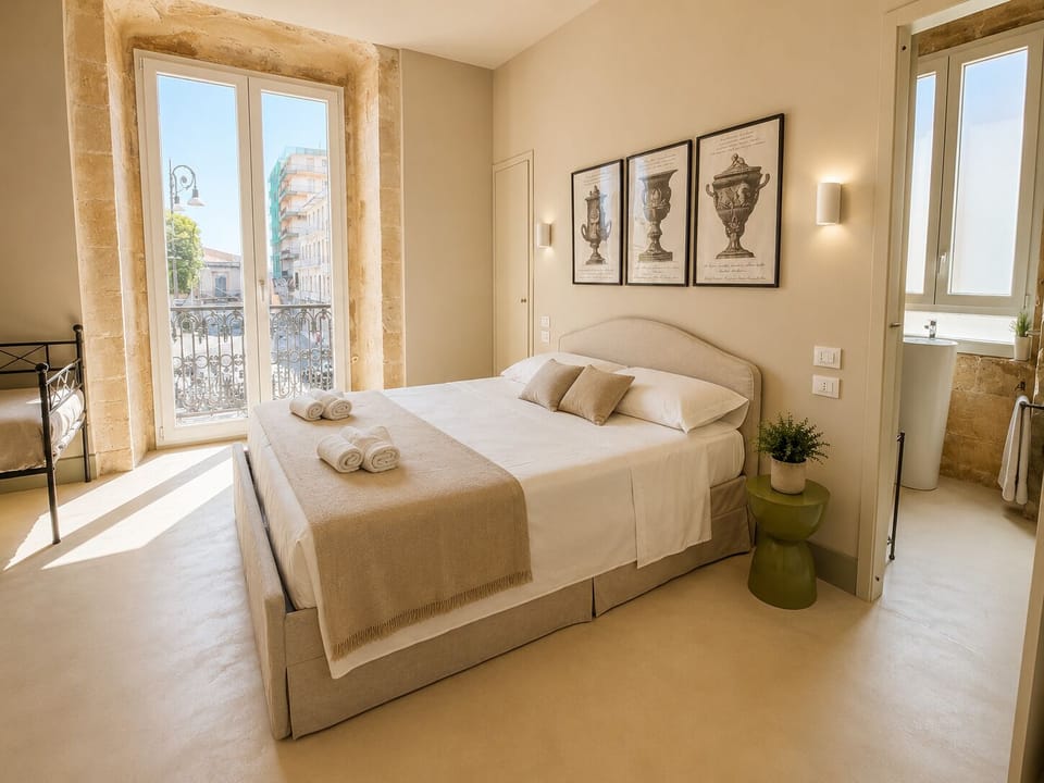 Deluxe Triple Room | Minibar, in-room safe, desk, laptop workspace