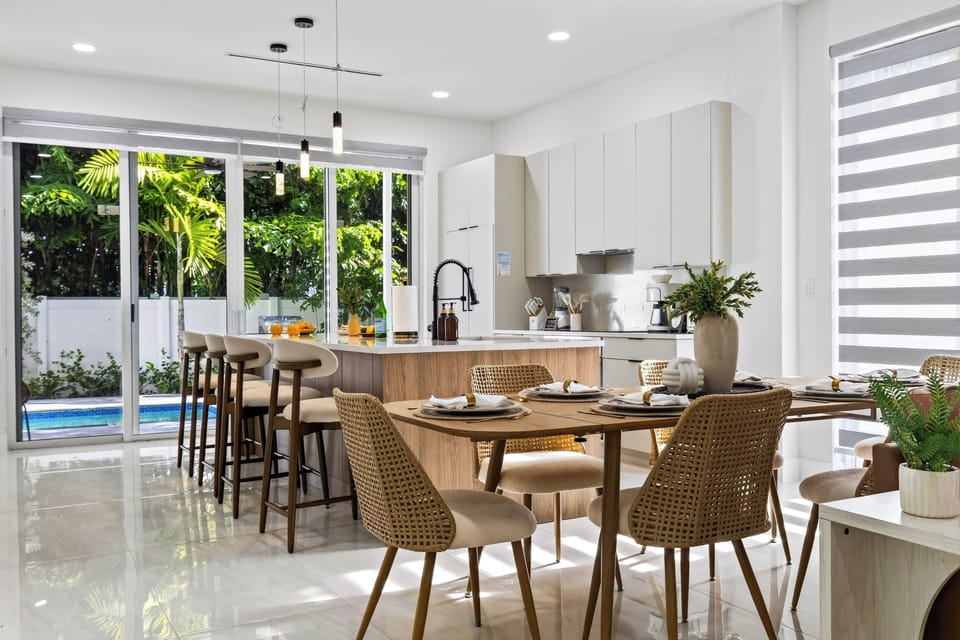 Gather for relaxed meals with the kitchen island and private pool just steps away. (Palm Court).