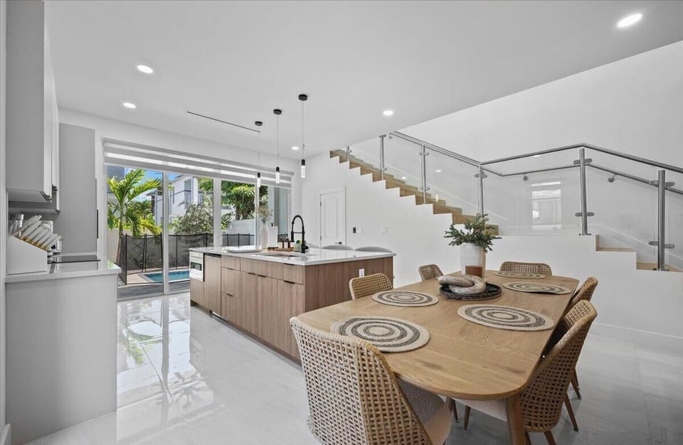Open-plan living and dining room with abundant natural light.