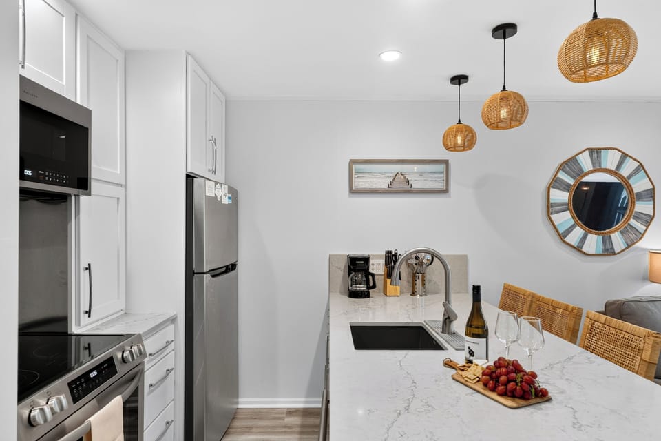 Side view of the kitchen space leading toward the entryway.