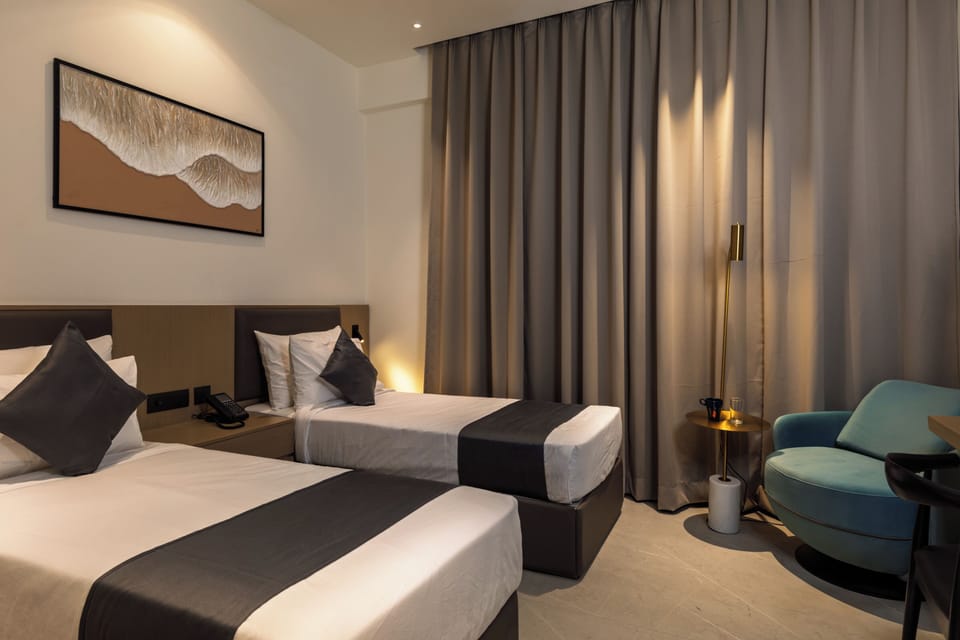 Deluxe Twin Room | Desk, laptop workspace, blackout drapes, iron/ironing board (on request)