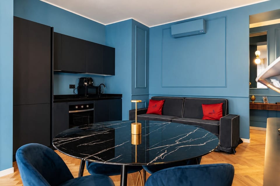 Deluxe Apartment, Balcony, City View | Living area | 50-inch Smart TV with cable channels