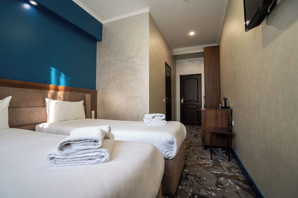 Double or Twin Room, City View | In-room safe, desk, blackout drapes, iron/ironing board
