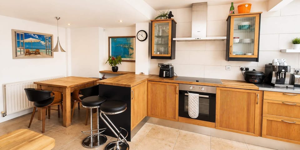 Whip up your favorite meals in a warm, fully stocked kitchen designed for effortless social dining.