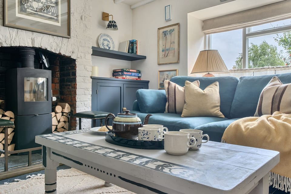 Ropers Cottage, Bridport: The wood burning stove is ideal for chillier days